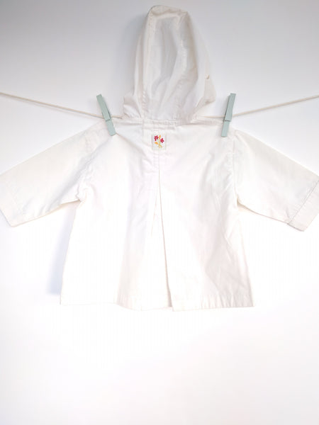 Manteau blanc avec motif fleur